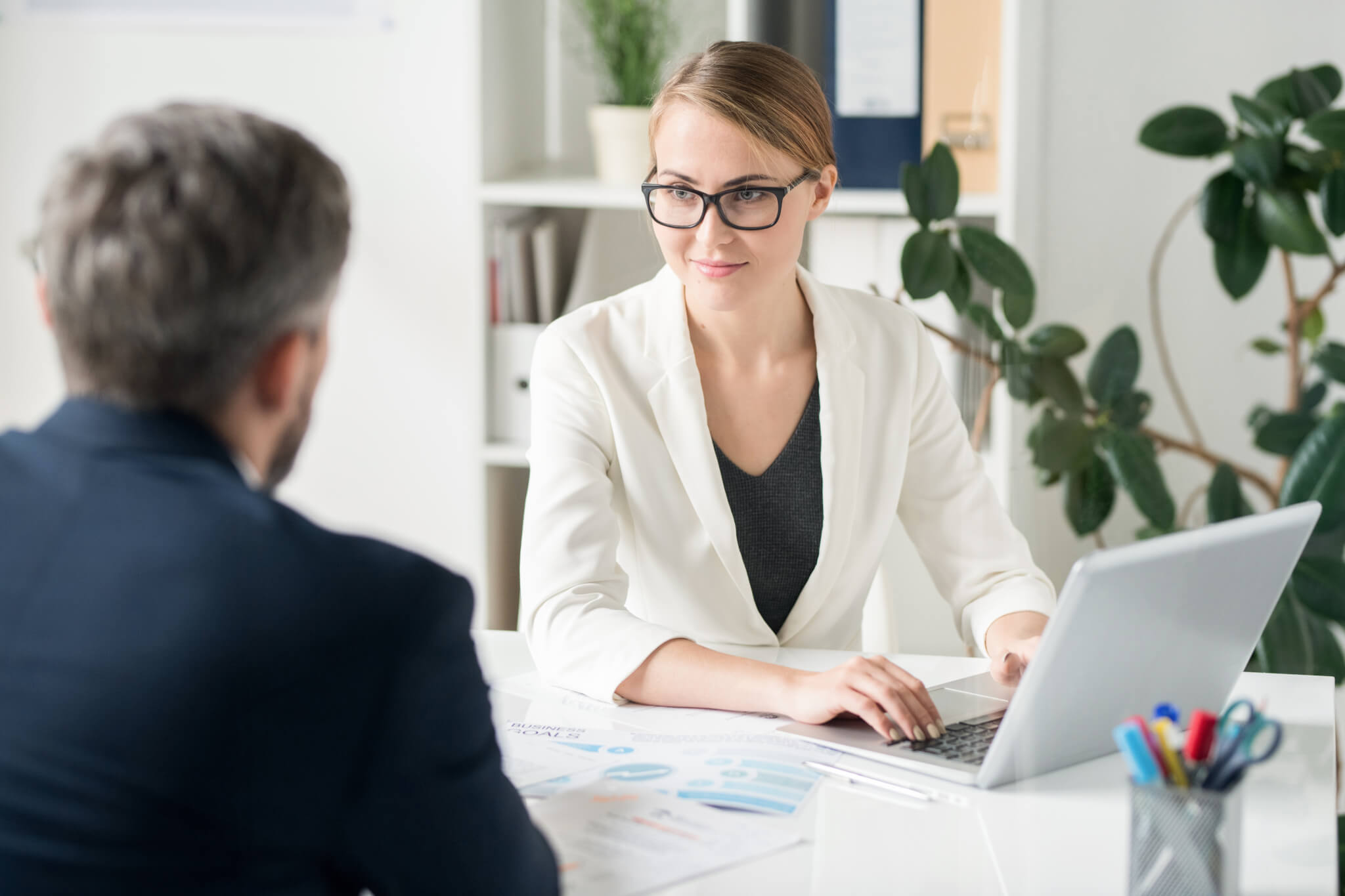 Female Business Consultant Working with client
